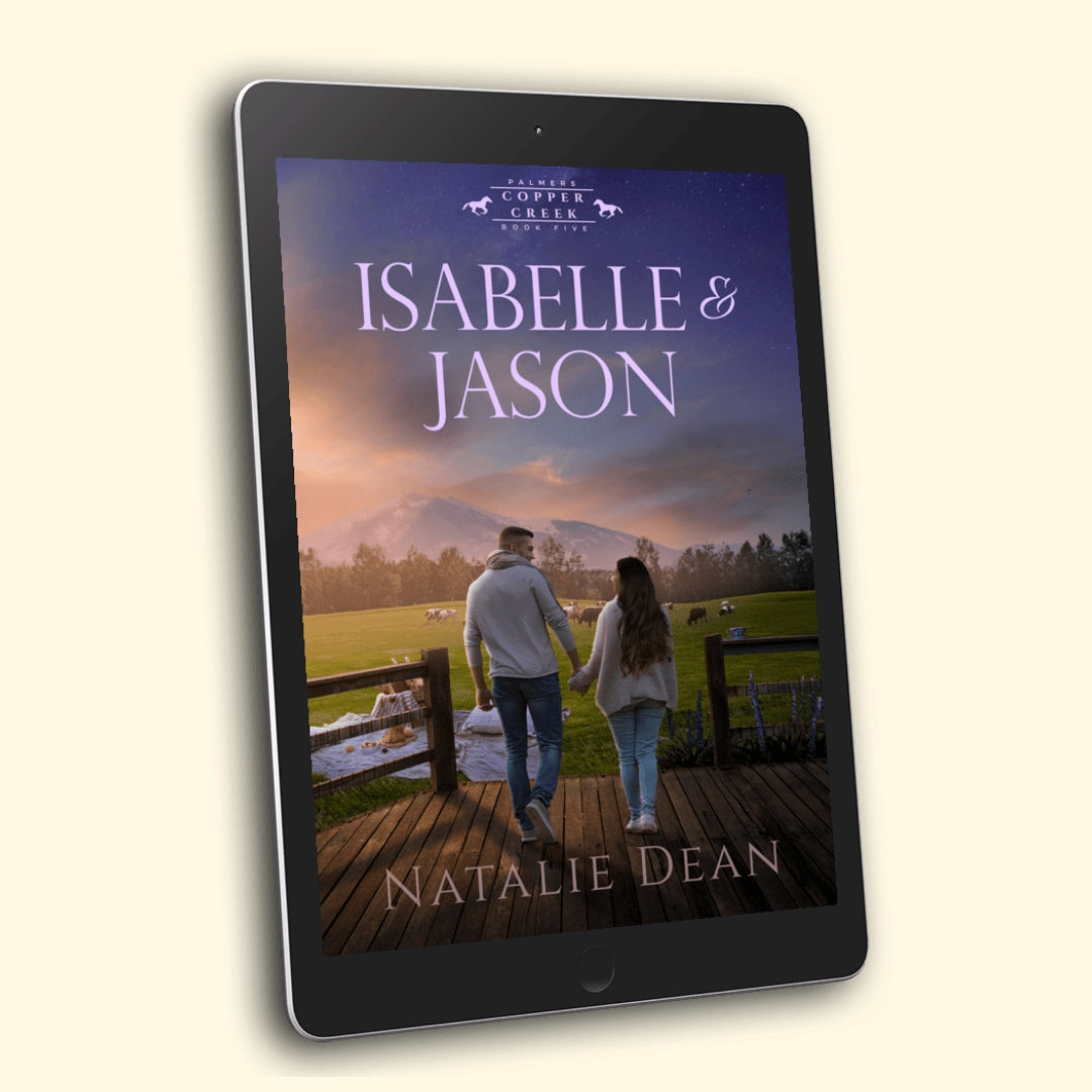Ebook Cover for - Isabelle & Jason, Palmers of Copper Creek Book Five by Natalie Dean, a wholesome small-town cowboy romance: a couple walks hand in hand across a ranch deck at sunset; picnic blanket, steaming mug, grazing cattle, and snow-tipped mountains under a starry sky.