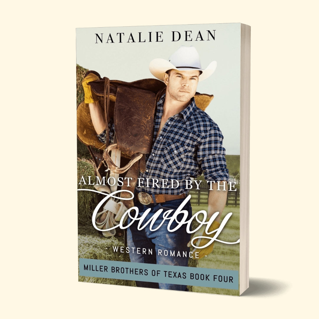 Paperback book mockup of Almost Fired by the Cowboy, Miller Brothers of Texas Book Four, by Natalie Dean; western romance, man in flannel shirt and cowboy hat holding a horse saddle