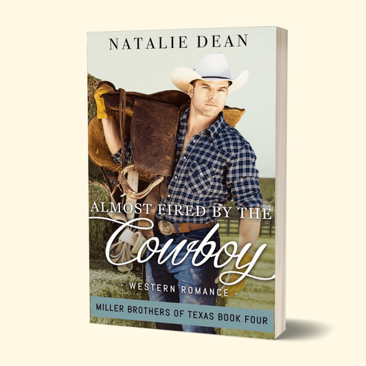 Paperback book mockup of Almost Fired by the Cowboy, Miller Brothers of Texas Book Four, by Natalie Dean; western romance, man in flannel shirt and cowboy hat holding a horse saddle